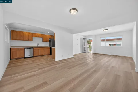 a kitchen with wooden floors and a stove