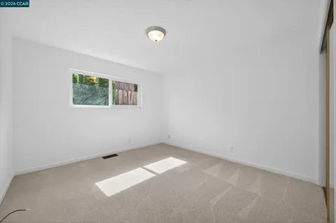 a view of a house with basketball court