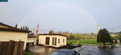 a front view of a house with retail shops
