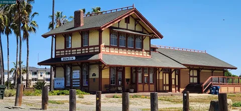 a view of a balcony with chairs