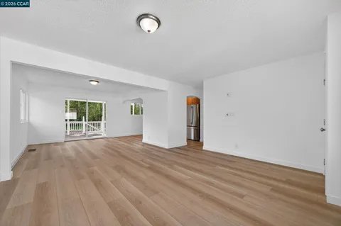 a kitchen with stainless steel appliances granite countertop a refrigerator a stove top oven a sink and dishwasher