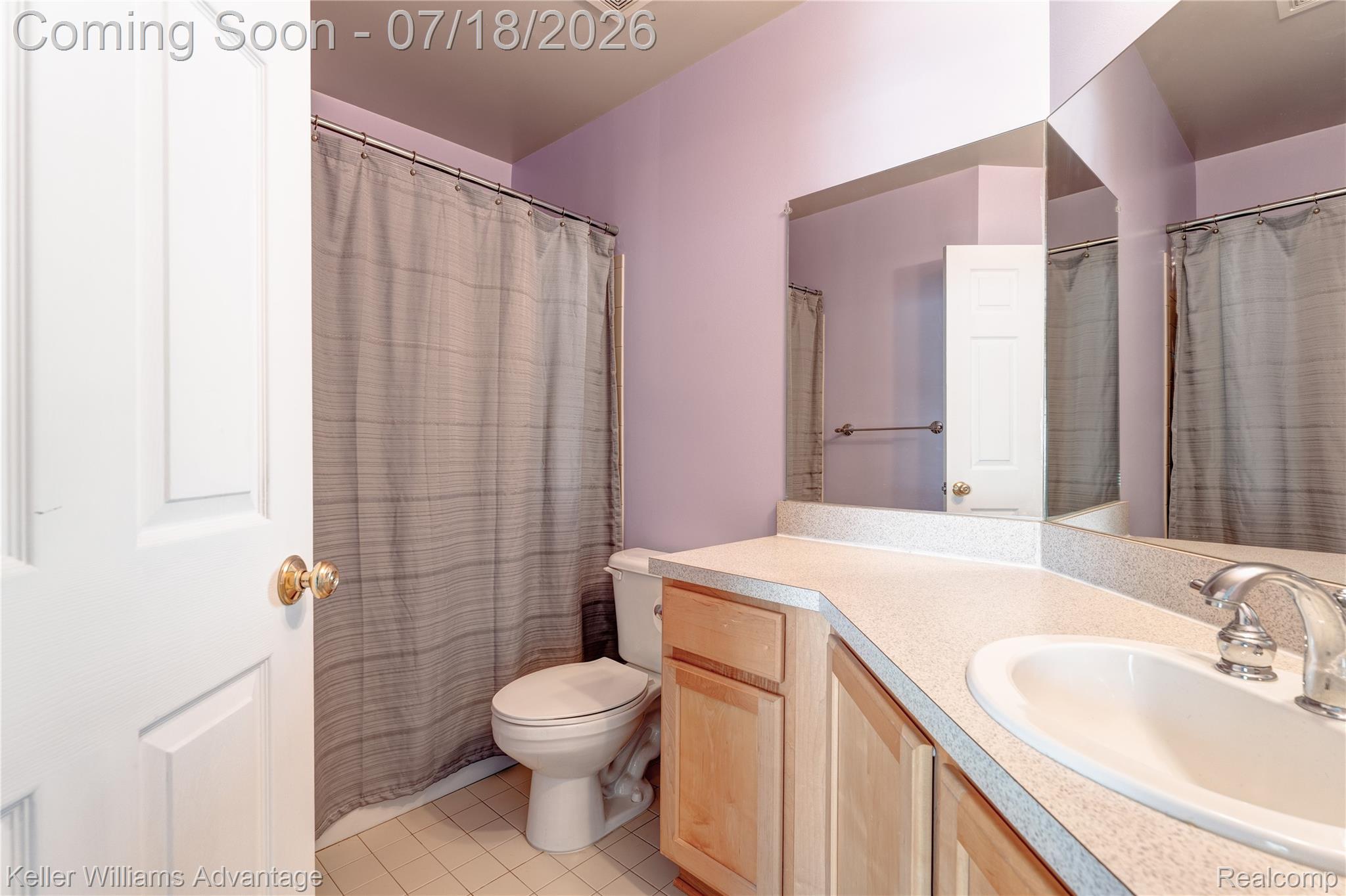 41647 Mitchell Road Novi, MI 48377 - Photo 29 of 43 Bathroom featuring a light-colored vanity with built-in cabinetry, an integrated sink, and a large wall-mounted mirror