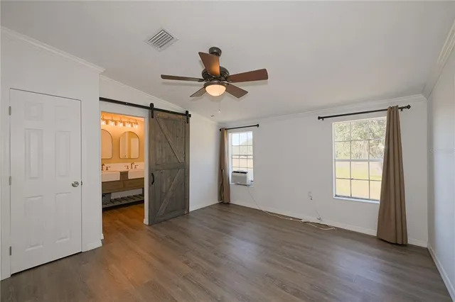 a spacious bathroom with a double vanity sink a mirror and bathtub
