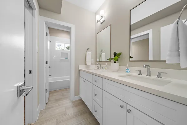 a white bath tub sitting next to a white toilet
