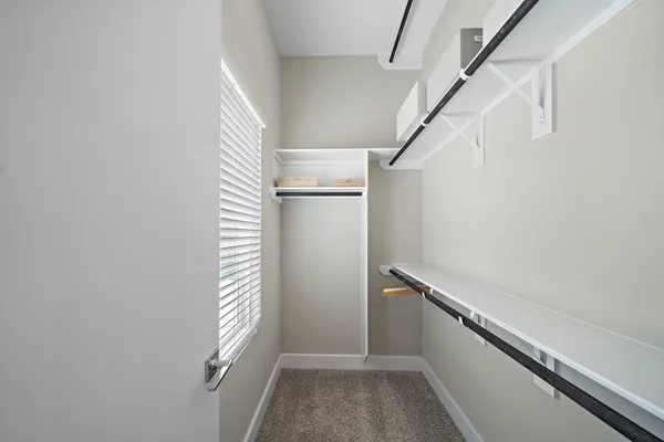 a bathroom with a granite countertop sink two mirror and a