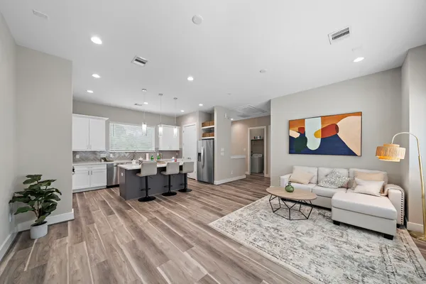 a living room with furniture and a rug