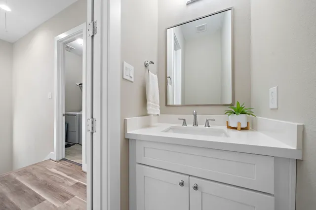 a kitchen with stainless steel appliances kitchen island granite countertop a sink and cabinets