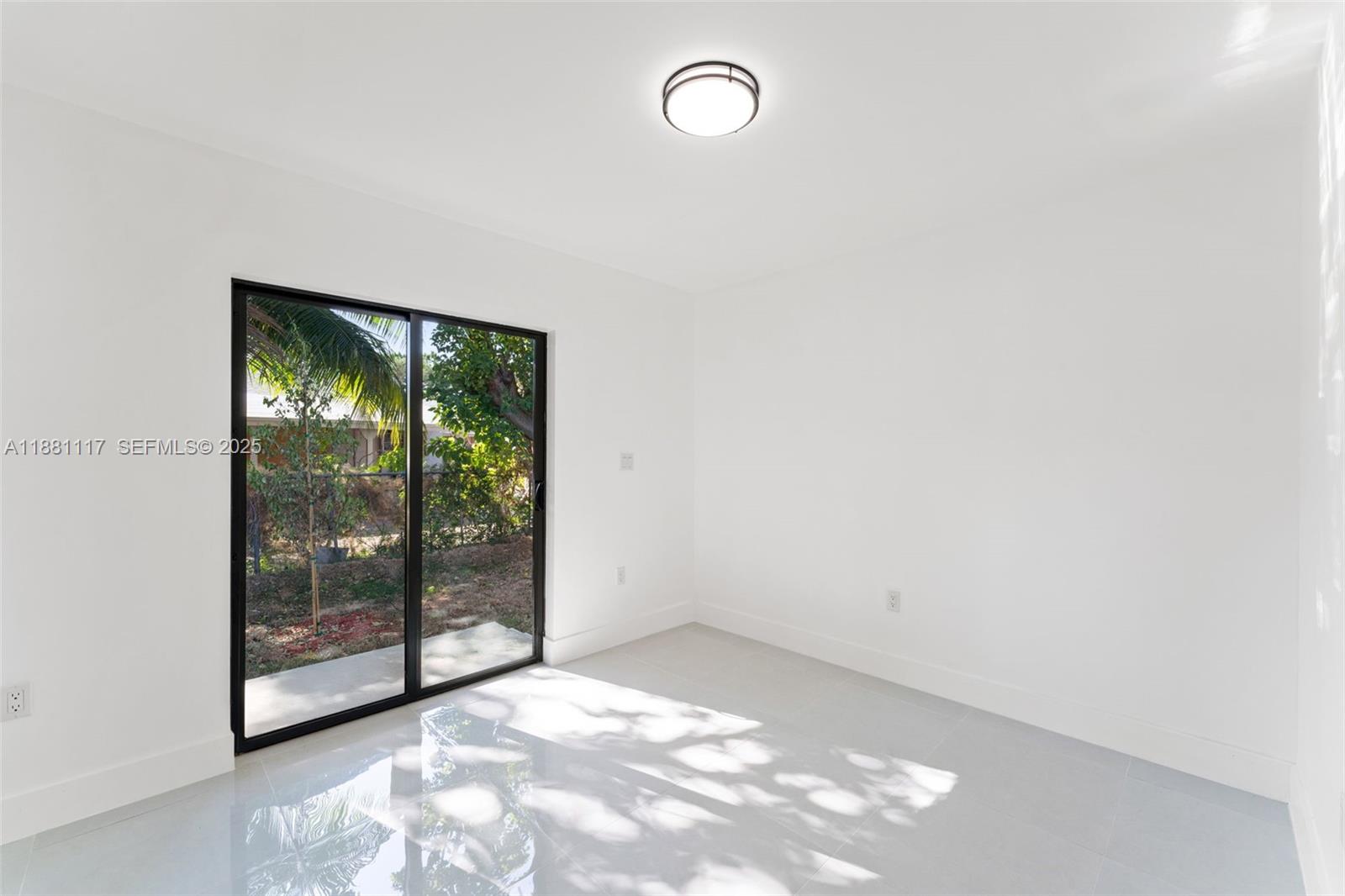 1556 Northwest 68th Terrace Miami, FL 33147 - Photo 12 of 14 a view of a room with window