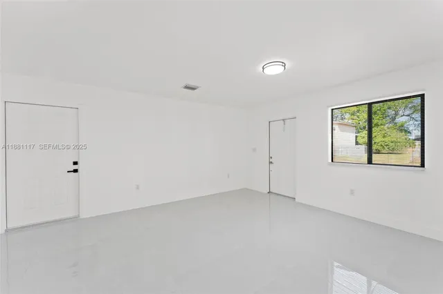 a bathroom with a double vanity sink and mirror