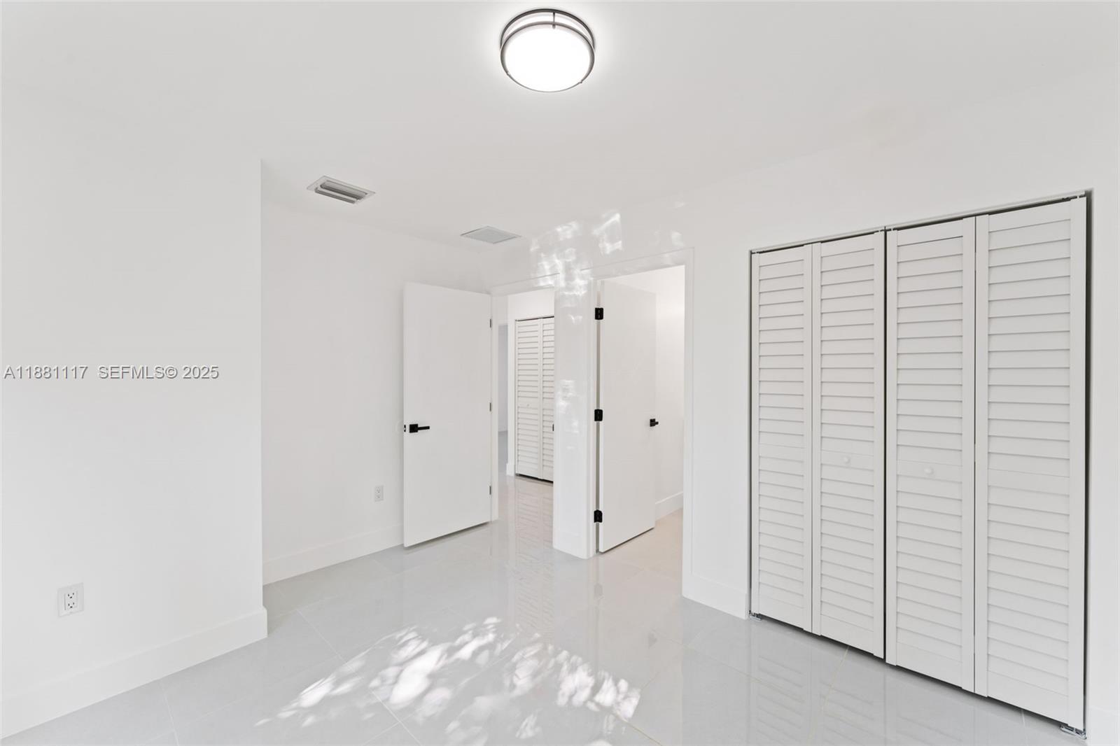 1556 Northwest 68th Terrace Miami, FL 33147 - Photo 10 of 14 a view of a room with an empty space