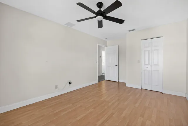 an aerial view of a house with a yard and plants