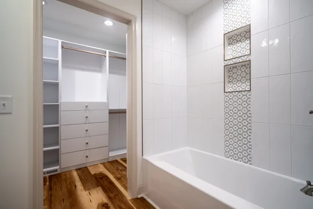 a view of a hallway with washer and dryer