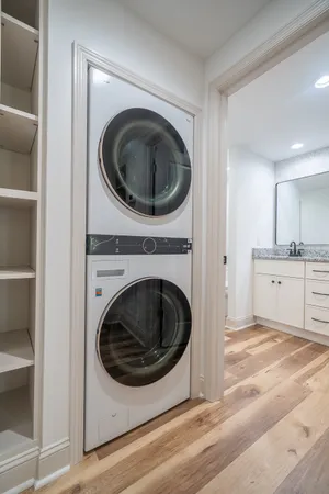 an empty room with closet and windows