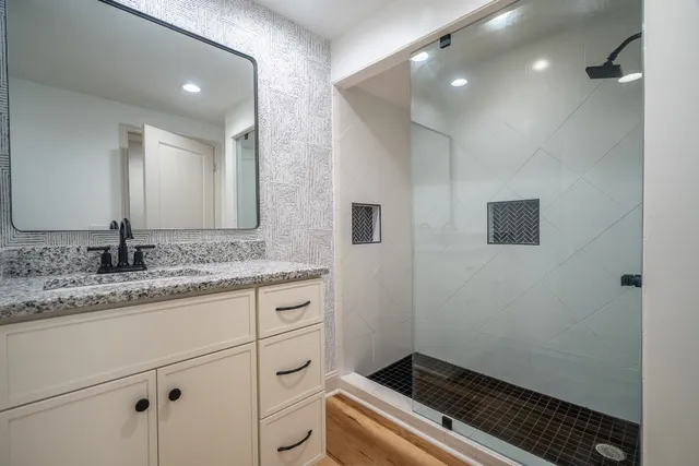 a view of a hallway with wooden floor