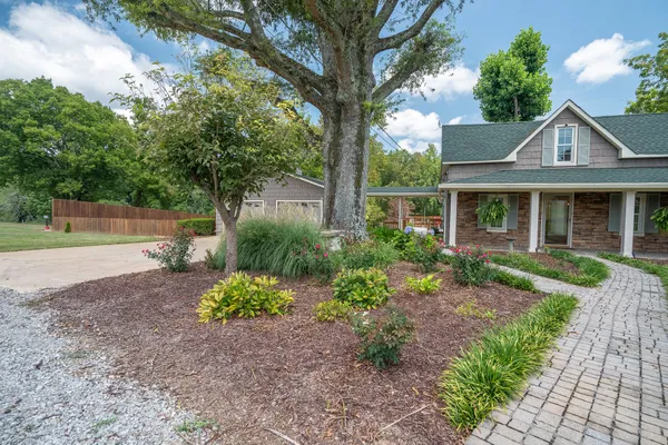 front view of a house with a yard