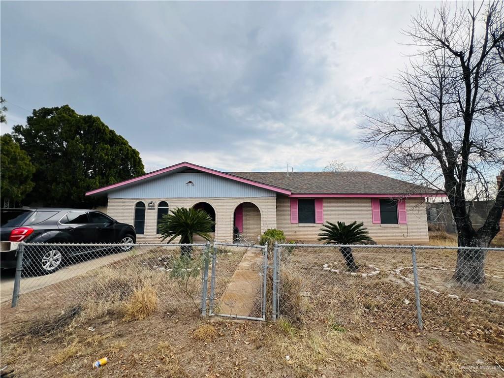 104 North Mitchell Street Rio Grande City, TX 78582 - Photo 1 of 1 a view of a white house with a yard covered in snow