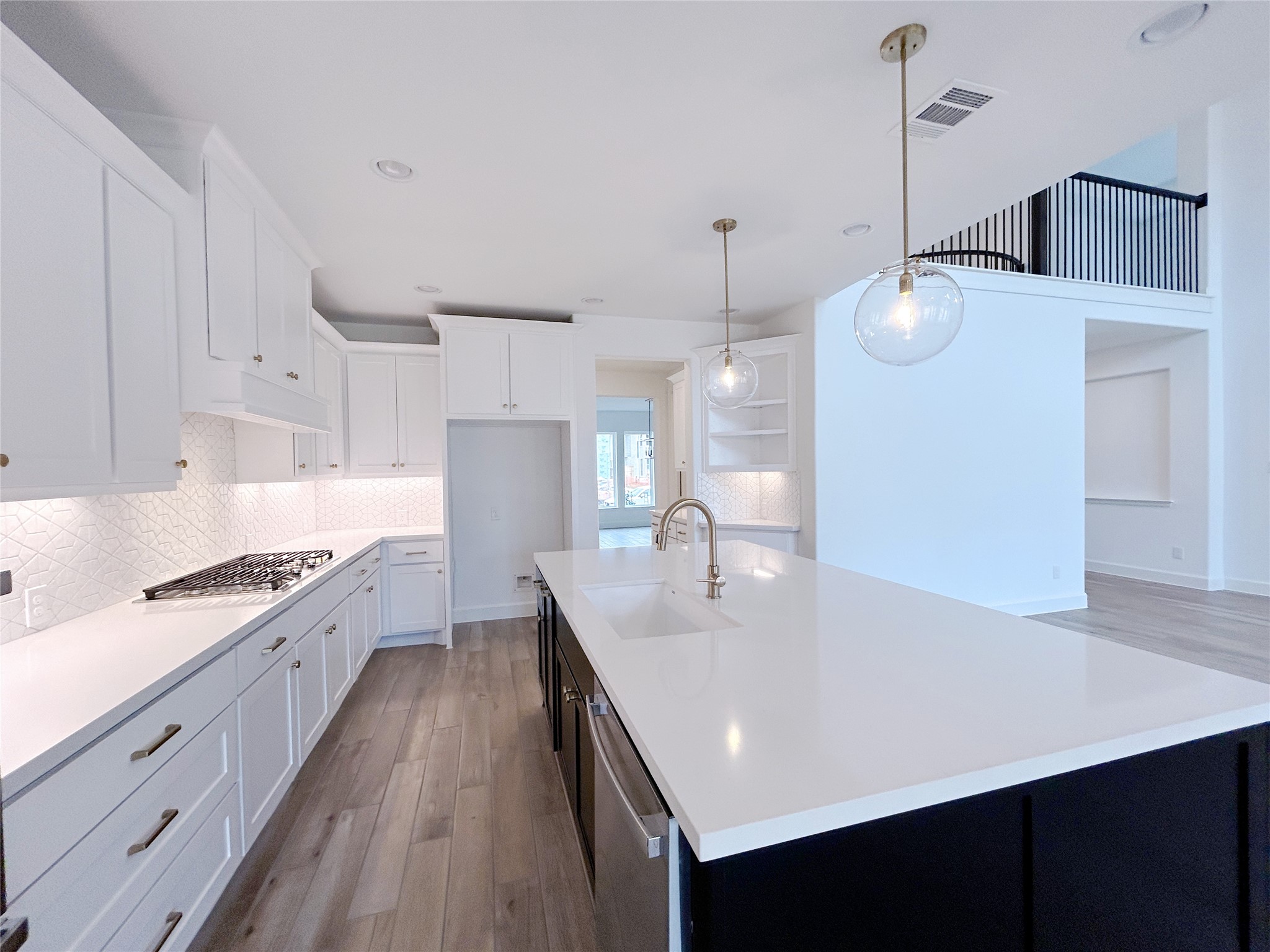 29847 Longleaf Grv Lane Fulshear, TX 77441 - Photo 16 of 39 a large kitchen with kitchen island a sink stainless steel appliances and cabinets