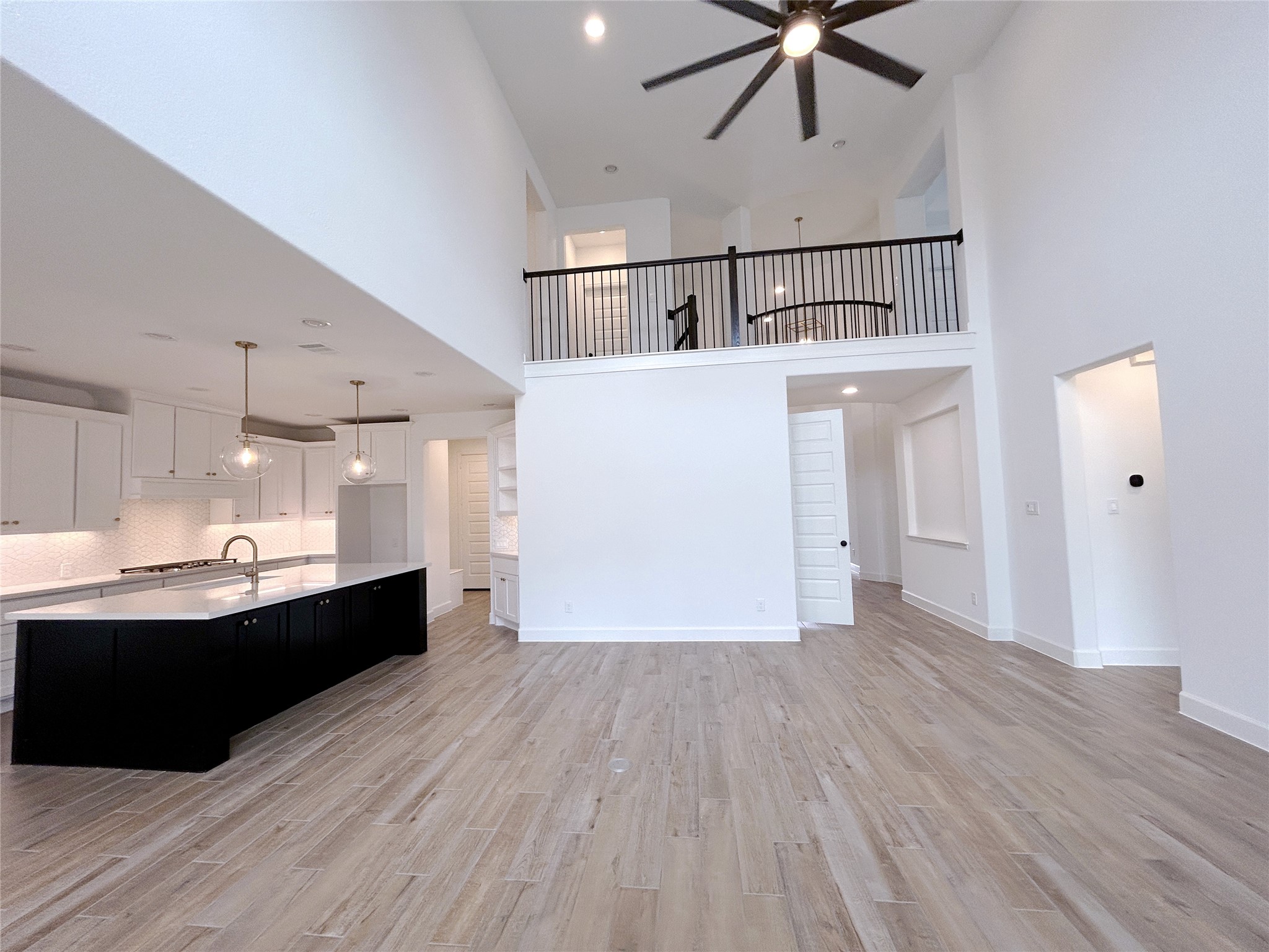 29847 Longleaf Grv Lane Fulshear, TX 77441 - Photo 17 of 39 a view of kitchen with cabinets and wooden floor