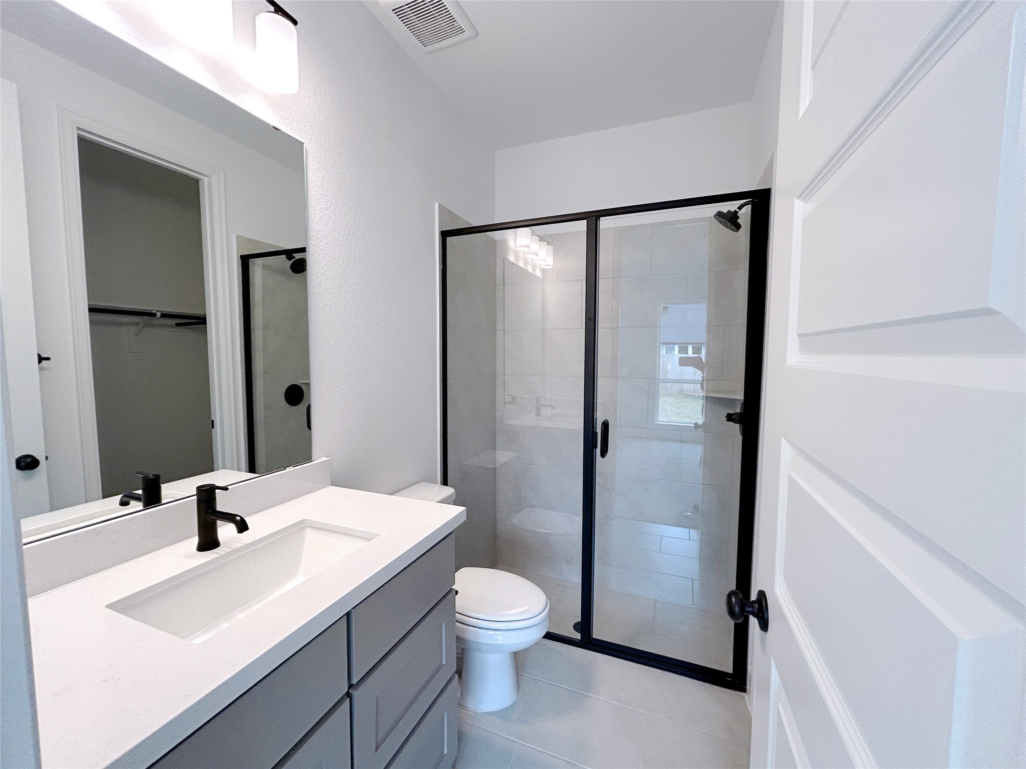 29847 Longleaf Grv Lane Fulshear, TX 77441 - Photo 19 of 39 a bathroom with a sink a toilet and shower