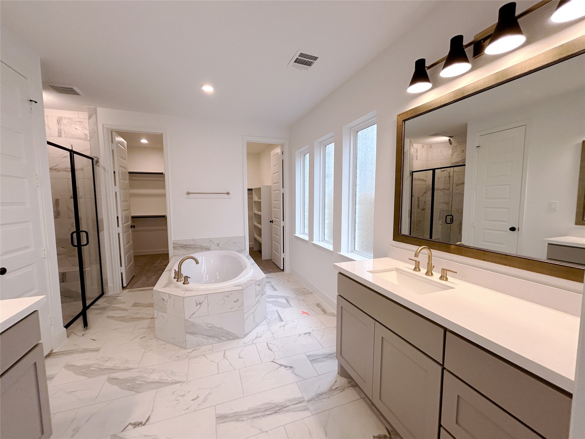 29847 Longleaf Grv Lane Fulshear, TX 77441 - Photo 27 of 39 a spacious bathroom with a sink double vanity shower and a mirror