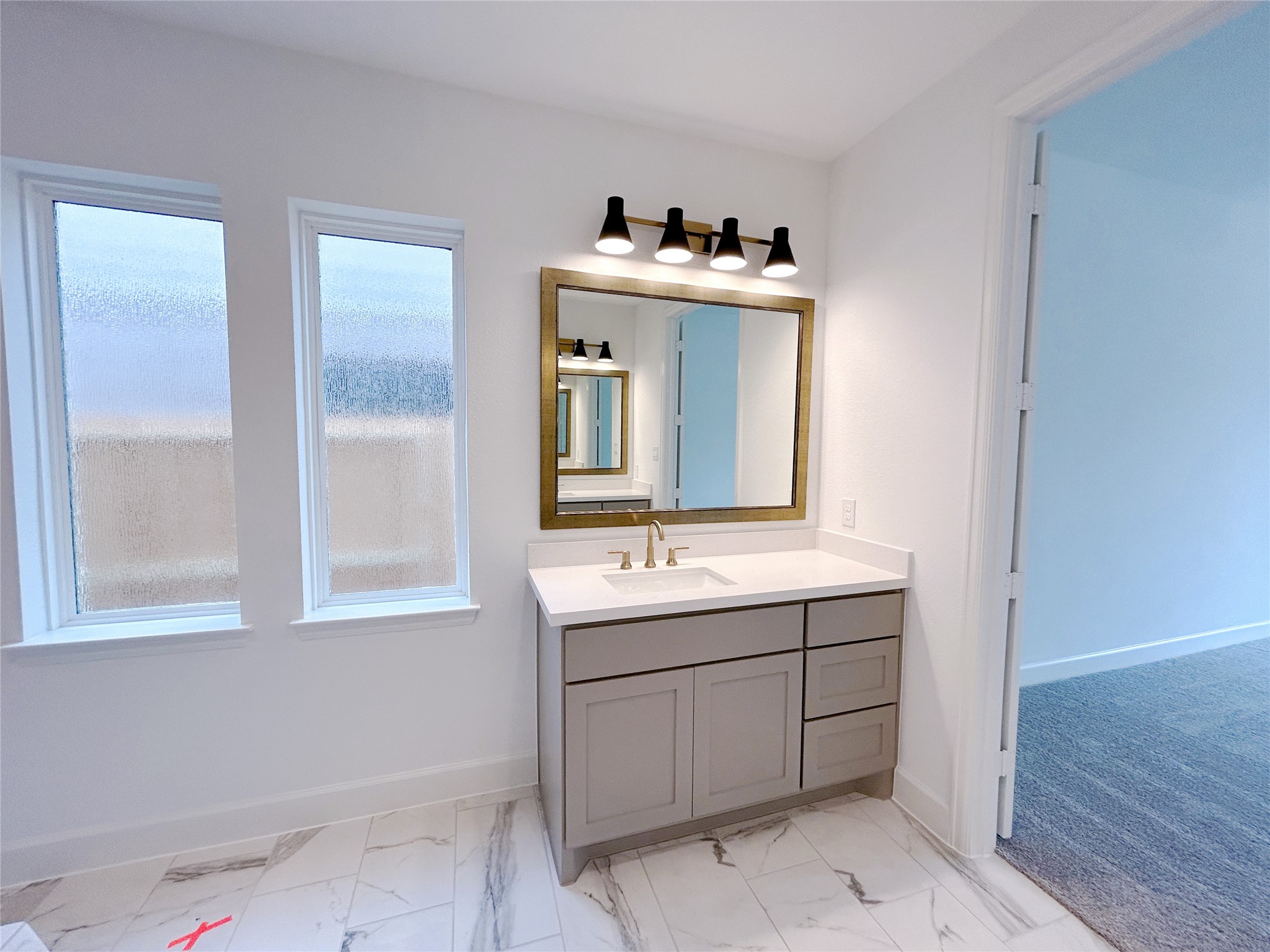 29847 Longleaf Grv Lane Fulshear, TX 77441 - Photo 31 of 39 a bathroom with a sink and a mirror