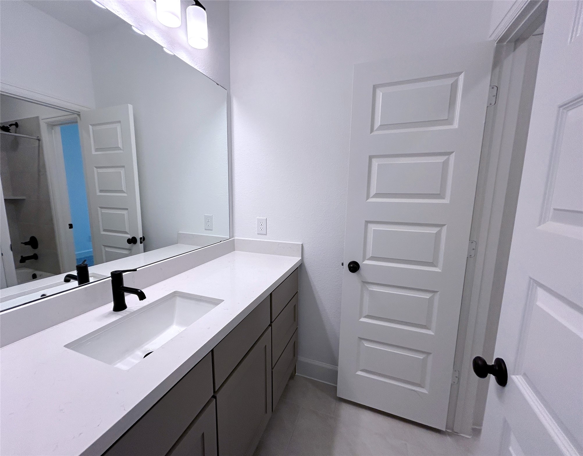 29847 Longleaf Grv Lane Fulshear, TX 77441 - Photo 36 of 39 a bathroom with a sink and a mirror