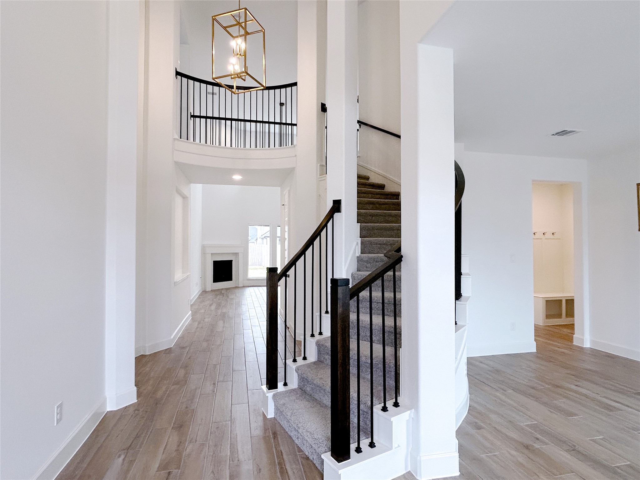 29847 Longleaf Grv Lane Fulshear, TX 77441 - Photo 4 of 39 a view of entryway with wooden floor