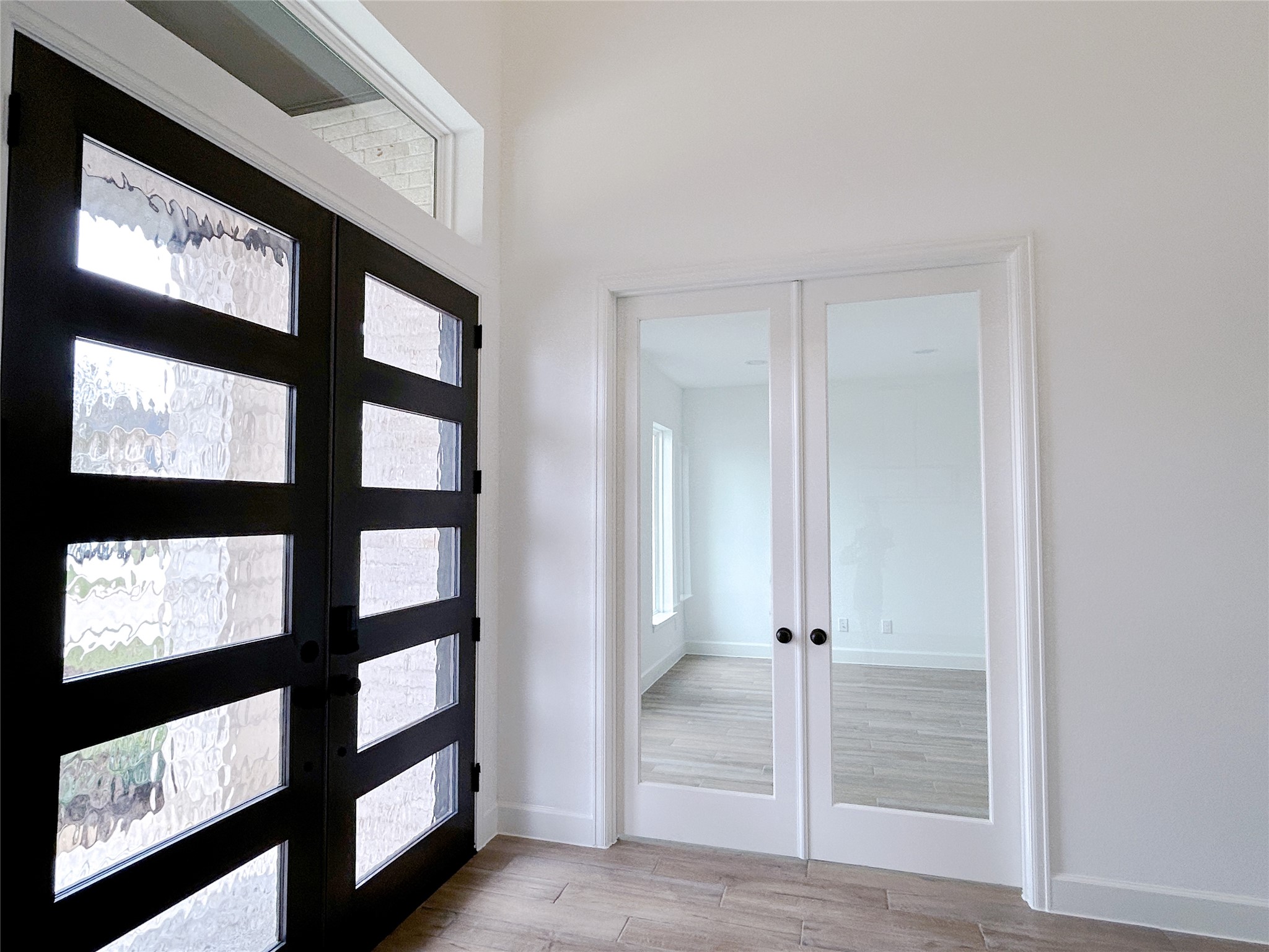 29847 Longleaf Grv Lane Fulshear, TX 77441 - Photo 5 of 39 a view of a hallway with windows