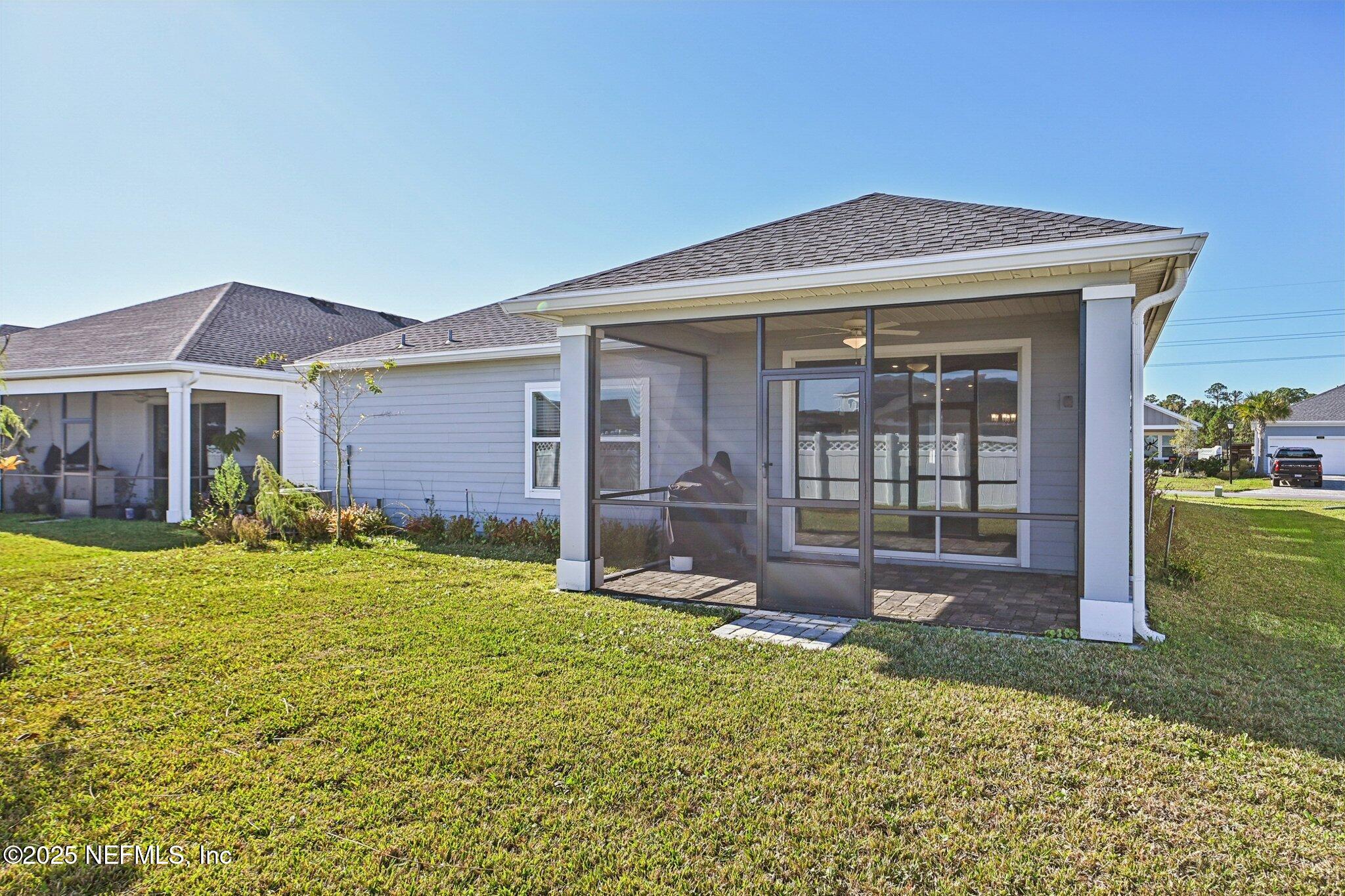 181 Varner Way St. Augustine, FL 32092 - Photo 26 of 27 a front view of a house with garden