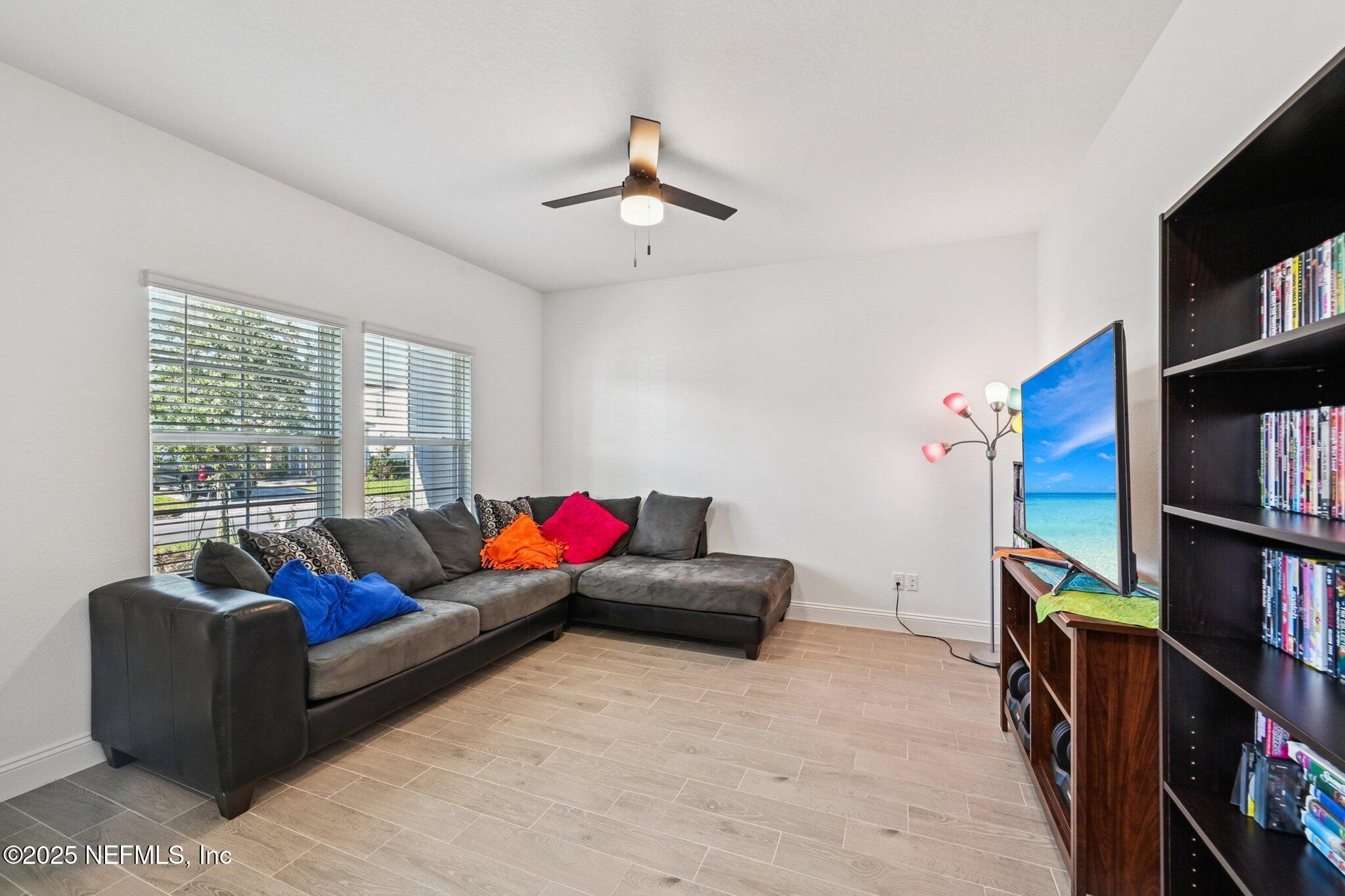 181 Varner Way St. Augustine, FL 32092 - Photo 3 of 27 a living room with furniture and a flat screen tv