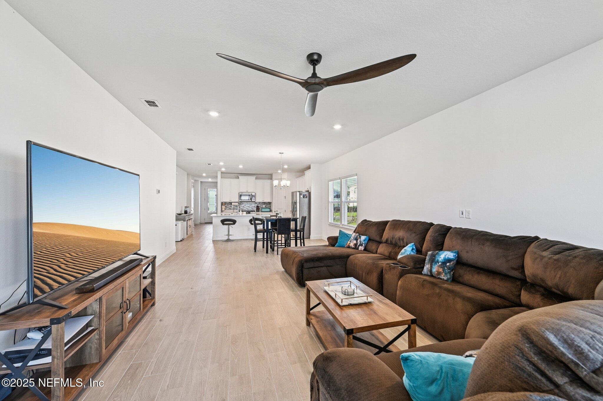 181 Varner Way St. Augustine, FL 32092 - Photo 7 of 27 a living room with furniture and a ceiling fan