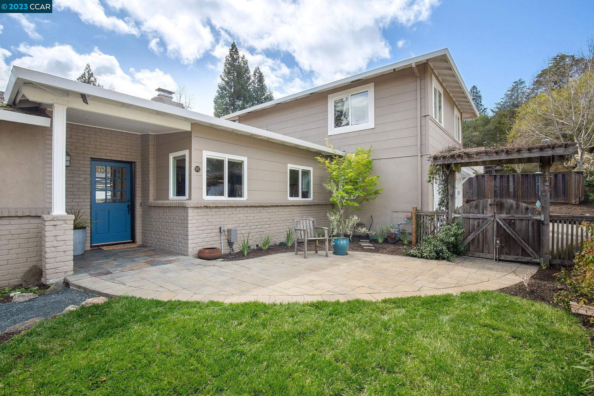 a view of a house with a yard and plants