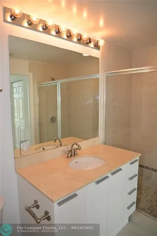 a bathroom with a sink and a mirror
