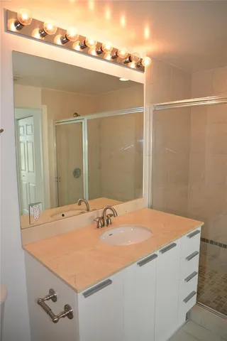 a bathroom with a sink and a mirror
