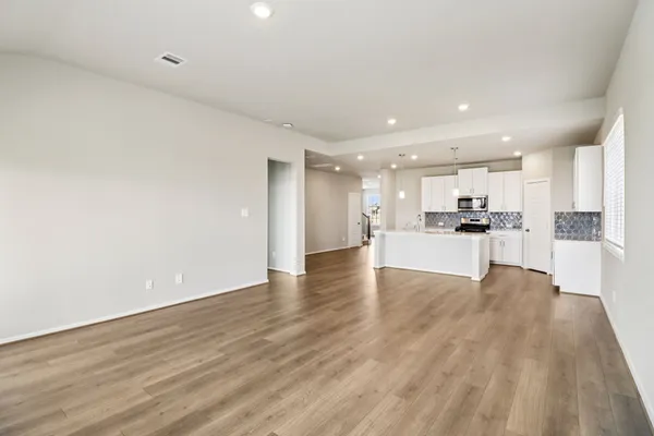 a view of kitchen with wooden floor