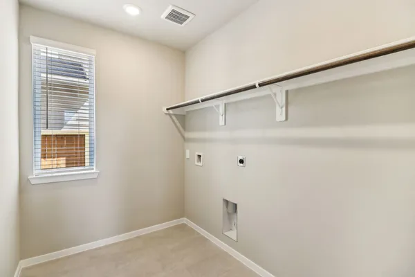 a view of a small space with wooden floor and windows