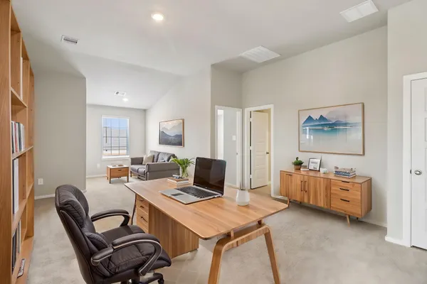 a workspace with furniture and lamp