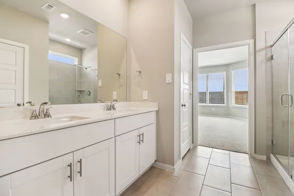 a bathroom with a granite countertop sink mirror and