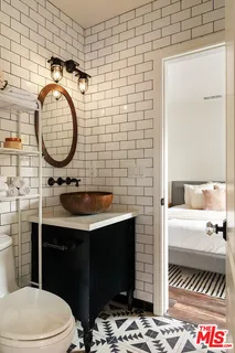 a bathroom with a toilet and a sink