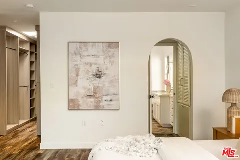 a bathroom with a granite countertop shower a sink and a mirror