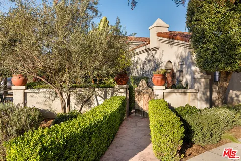 a living room with furniture fireplace and window