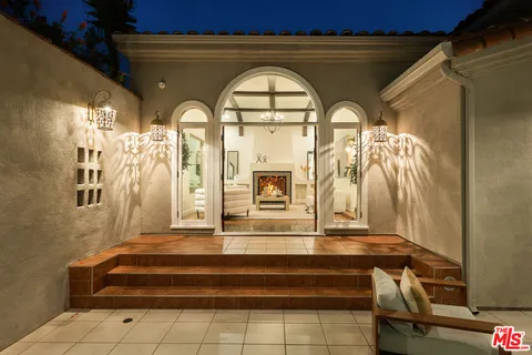 a outdoor living space with furniture and a potted plant