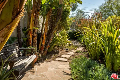 a patio with yard table and chairs