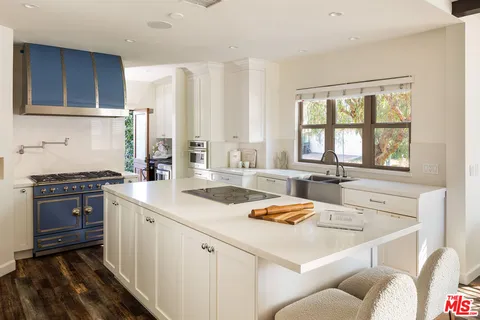 a bedroom with a bed and wall painting