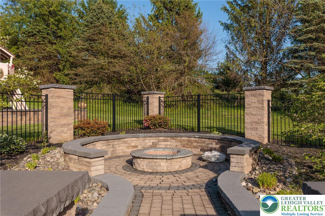2170 Clearview Road Coplay, PA 18037 - Photo 64 of 75 This serene outdoor space features a beautifully crafted fire pit, perfect for gatherings.