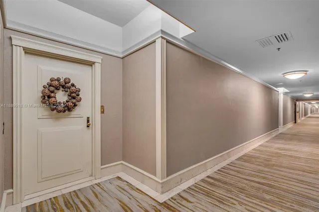 a view of a hallway with closet