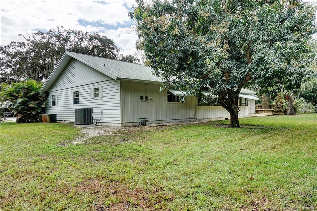 4 Miramar Road Sewall's Point, FL 34996 - Photo 24 of 31 a house with huge green field in front of it