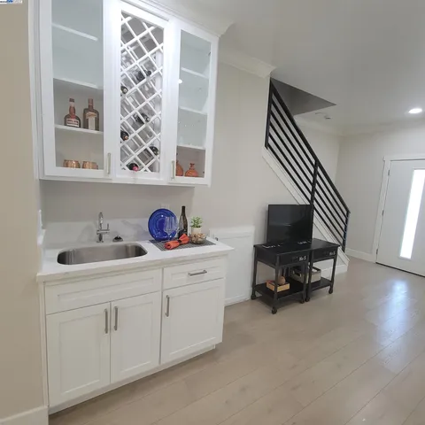 a kitchen with cabinets and window