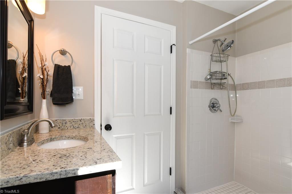 3703 Pinetop Road Greensboro, NC 27410 - Photo 13 of 30 Bathroom on Main with a separate shower