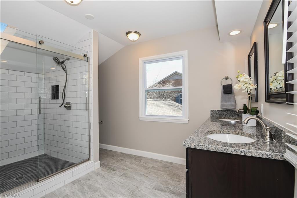 3703 Pinetop Road Greensboro, NC 27410 - Photo 16 of 30 Fully remodeled Master Bathroom! Schluter Shower System is used for the separate shower- lifetime no-leak guranaty for both floor and walls!